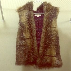 Faux fur vest with hood. Very cute and warm.